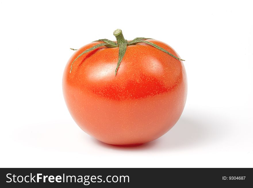 Single juicy tomato, isolated on white background