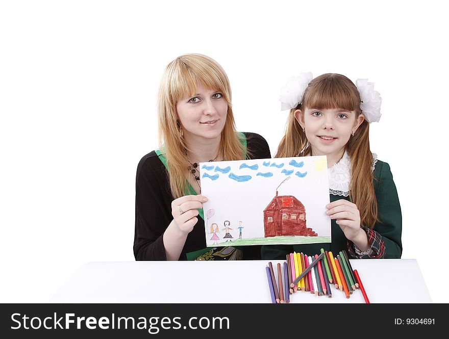 Woman and girl are holding the picture. Mother and her young daughter drawing together. Girl is painting her family in bright colours. Isolated over white background. Woman and girl are holding the picture. Mother and her young daughter drawing together. Girl is painting her family in bright colours. Isolated over white background.