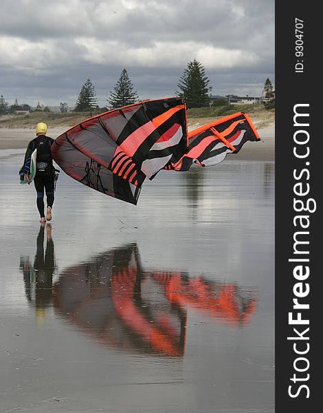 Kite surfer on the beach with kite. Kite surfer on the beach with kite