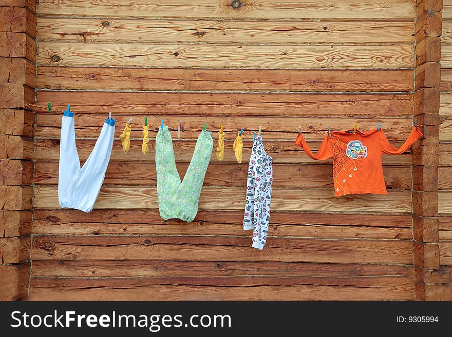 The clothes to dry on a cord after washing. The clothes to dry on a cord after washing