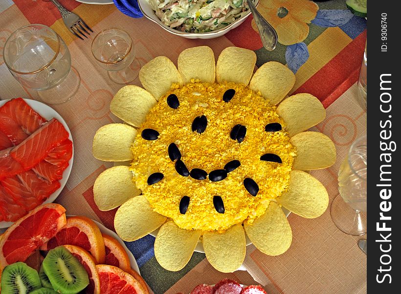Salad resembling sunflowers on a background of other foods. Salad resembling sunflowers on a background of other foods.