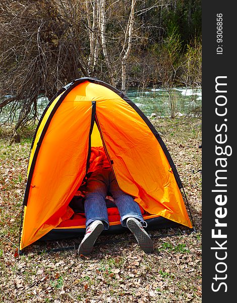 The person sleeps in tent