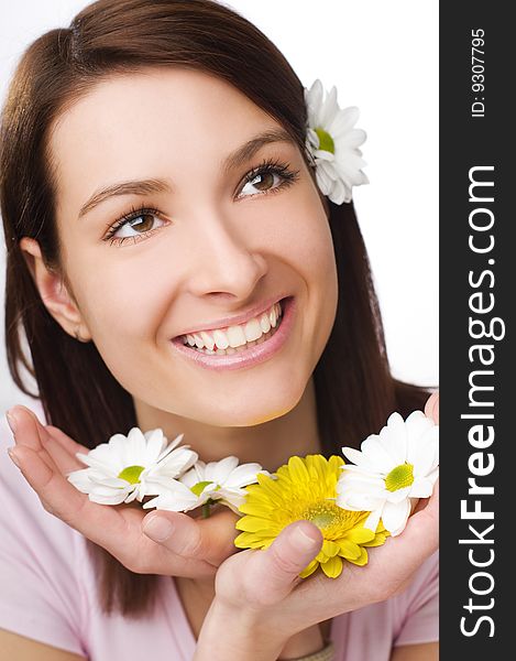 Beautiful young woman with flowers close up. Beautiful young woman with flowers close up