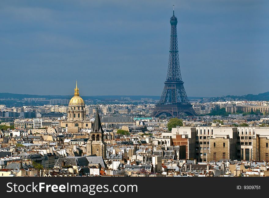 Eiffel Tower and Hotel des Invalides standing tall in Paris. Photo taken from the towers of Notre Dame.