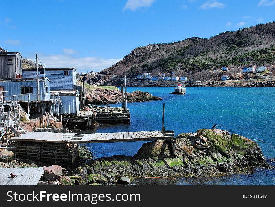 In harbour view of the Battery coastline that makes up the inner part of the harbour in St John's Newfoundland