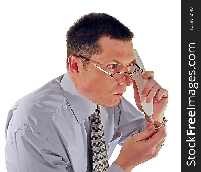 Portrait of man in glasses with a telephone