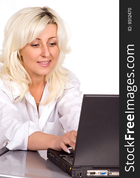 Blond woman working with laptop