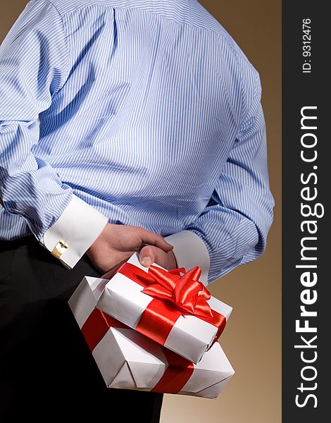 Man holding fine wrapped gift box