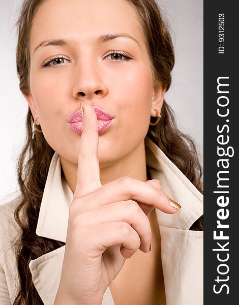 Perfect young woman making a silence sign. Perfect young woman making a silence sign