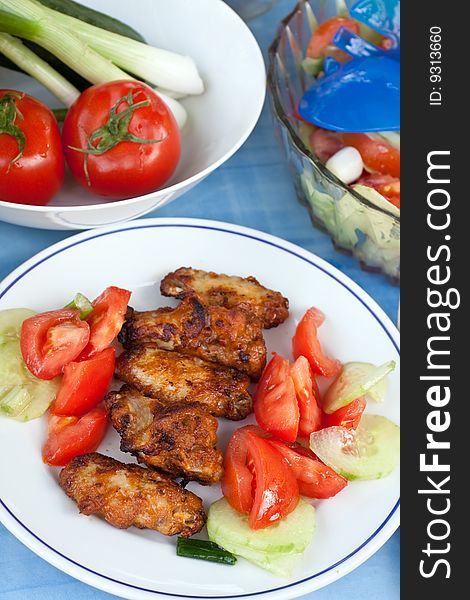 Grilled chicken legs with salad