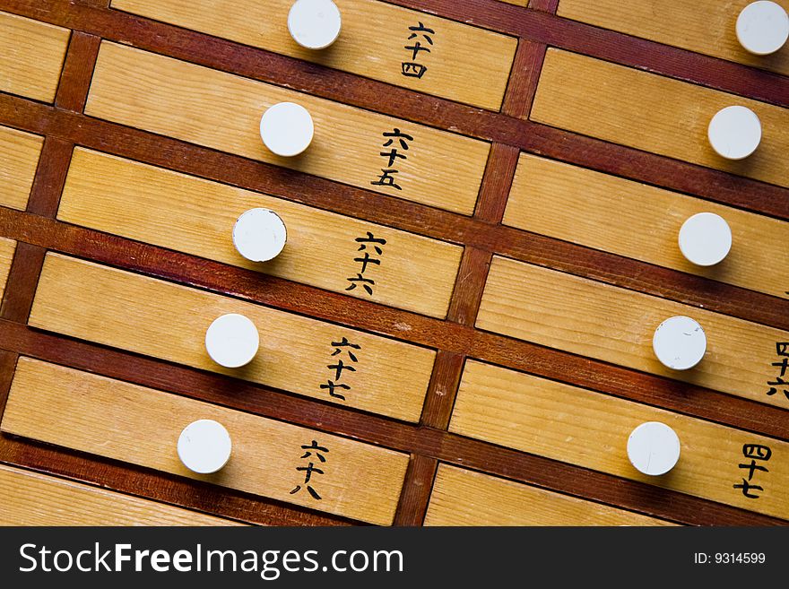 Close up of wooden trays at a Japanese temple