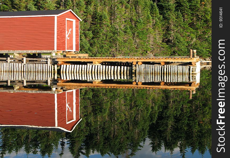 A crystal clear reflection of a fishing wharf. A crystal clear reflection of a fishing wharf.