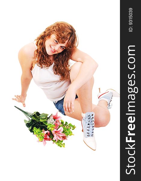 A young red haired girl in t-shirt and short shorts sitting on the floor,
smiling with a bunch of flowers in front of her. A young red haired girl in t-shirt and short shorts sitting on the floor,
smiling with a bunch of flowers in front of her.