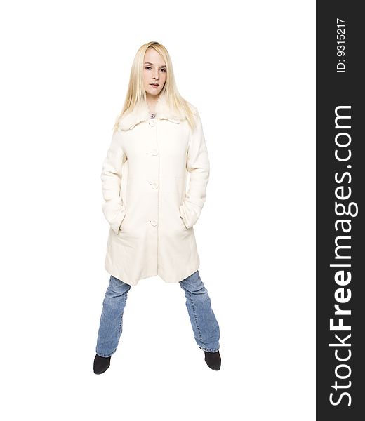 Isolated studio shot of a woman wearing a warm winter coat and blue jeans. Isolated studio shot of a woman wearing a warm winter coat and blue jeans.
