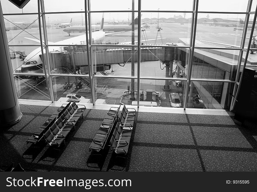 Airplane docked at the airport ready for passengers to board. Airplane docked at the airport ready for passengers to board.