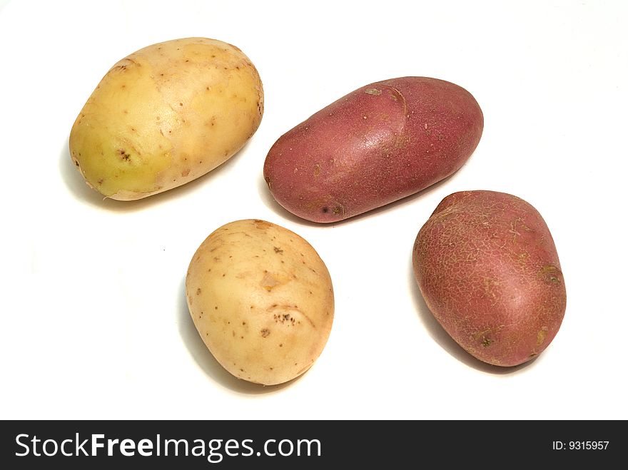 Four potatoes isolated on white background