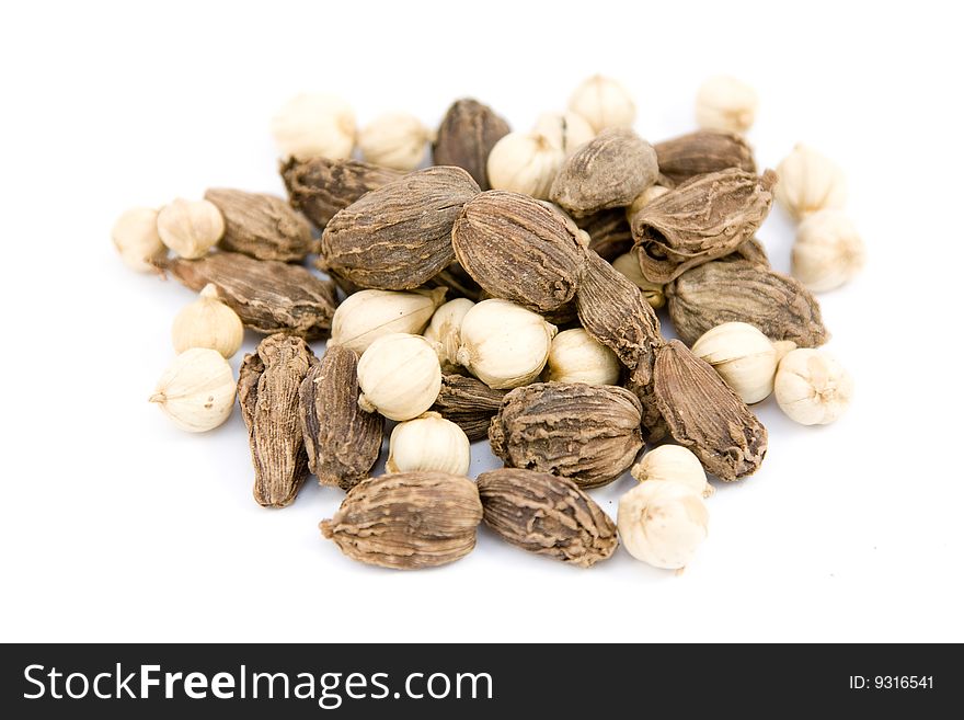 Black and white cardamom isolated on white