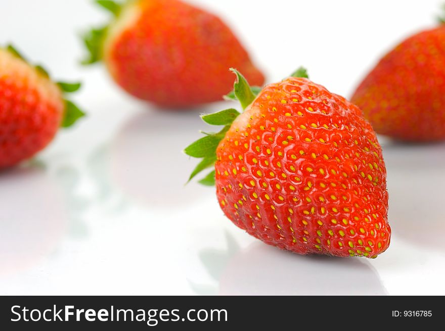 Fresh strawberries isolated against a white background