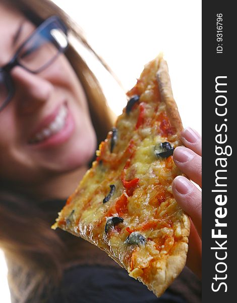 Beautiful young woman eating pizza