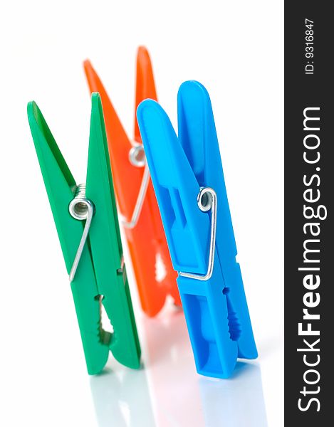 Clothes line pegs isolated against a white background