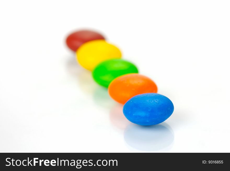 Chocolate coated candy isolated against a white background. Chocolate coated candy isolated against a white background