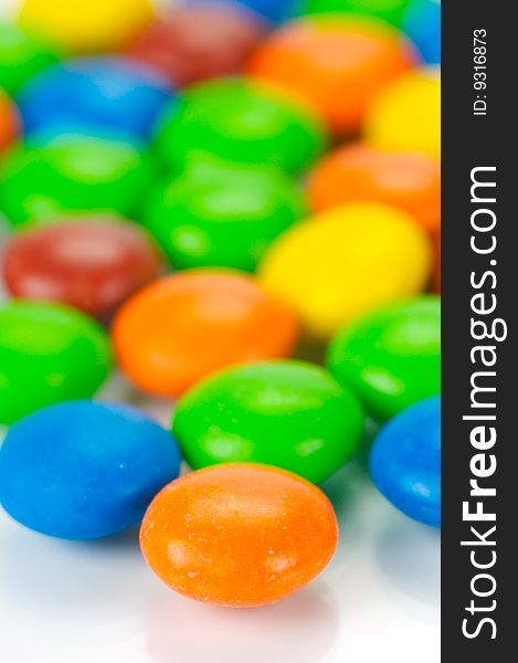 Chocolate coated candy isolated against a white background. Chocolate coated candy isolated against a white background