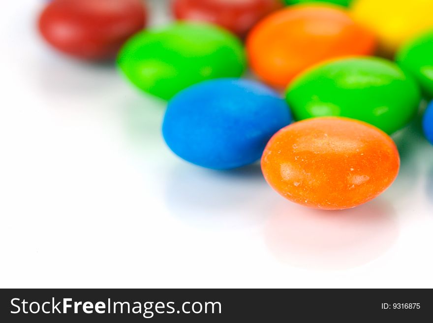 Chocolate coated candy isolated against a white background. Chocolate coated candy isolated against a white background