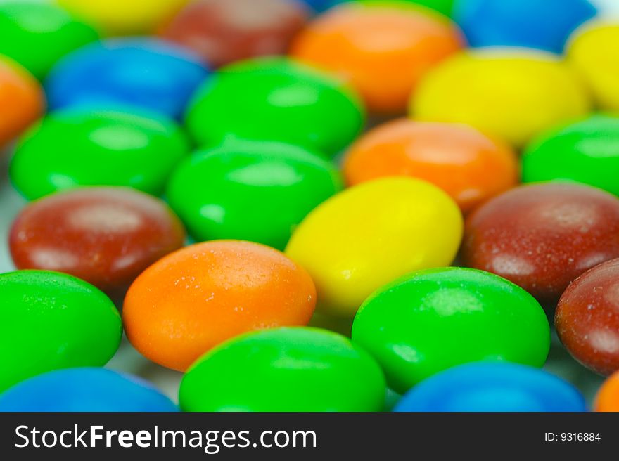 Chocolate coated candy isolated against a white background. Chocolate coated candy isolated against a white background