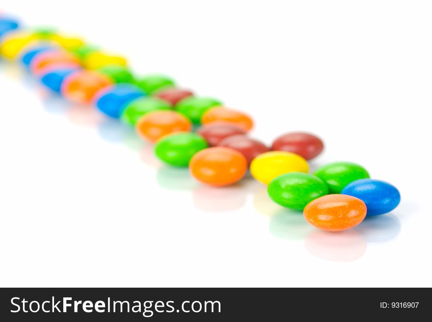 Chocolate coated candy isolated against a white background. Chocolate coated candy isolated against a white background