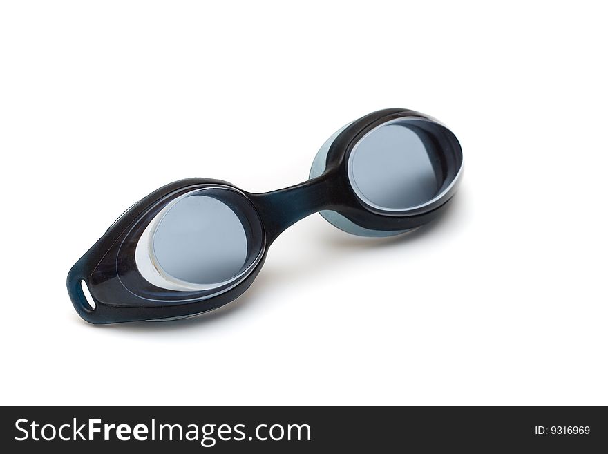 Black glasses for swim on white background reflect light. Black glasses for swim on white background reflect light