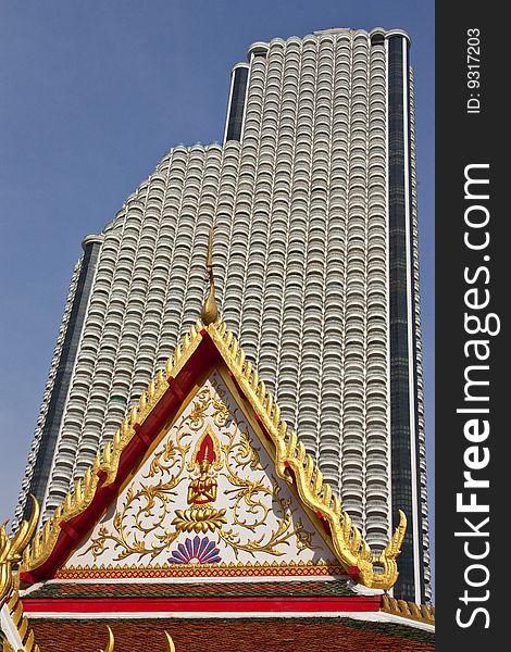 Modern huge building behind pavilion of Wat Suan Plu, Bangkok, Thailand. Modern huge building behind pavilion of Wat Suan Plu, Bangkok, Thailand