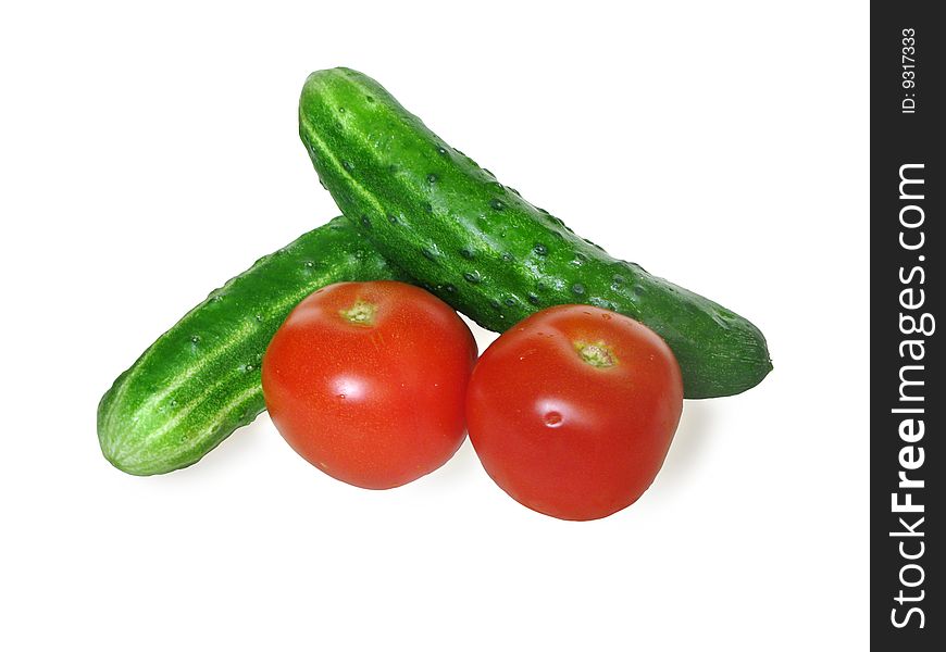Tomatoes and cucumbers isolated on a white background