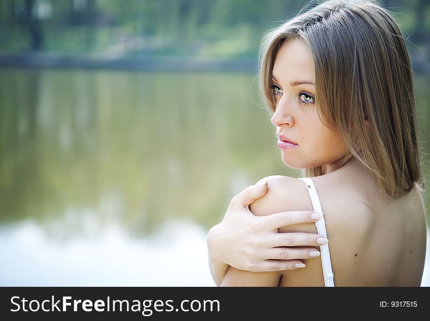 Sexy pretty young woman in natural background