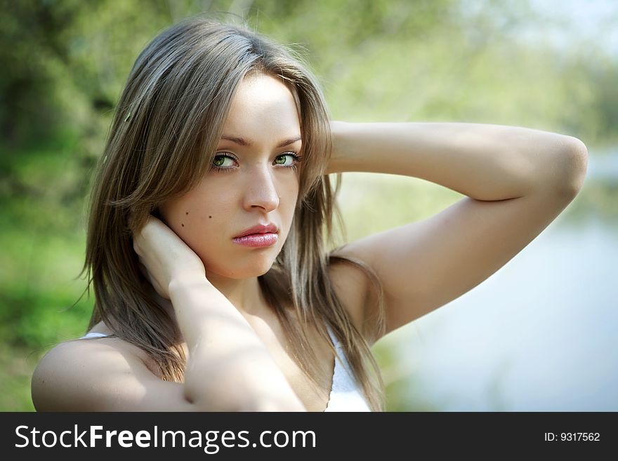 Sexy pretty young woman in natural background