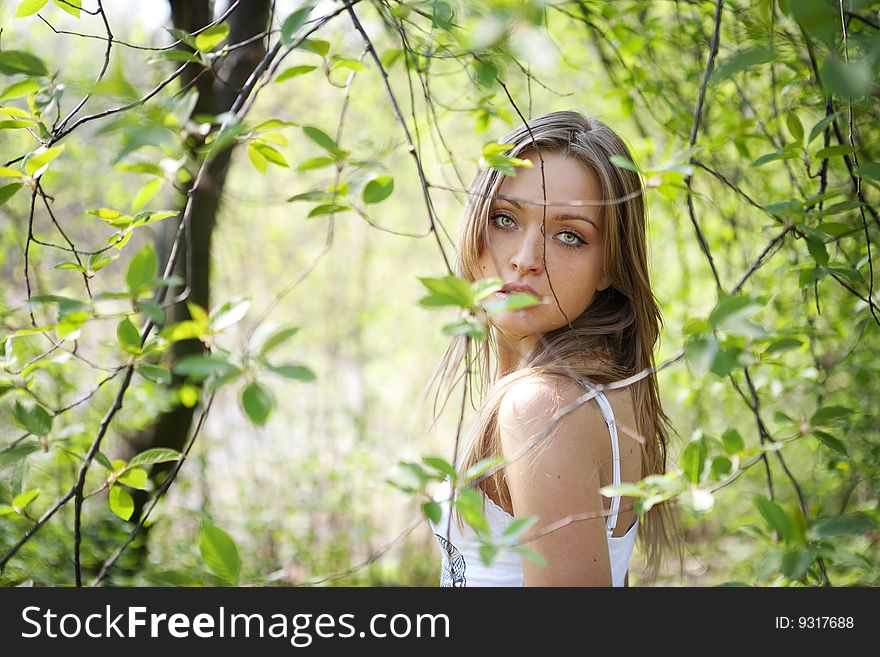 Portrait of a beautiful young lady in natural background