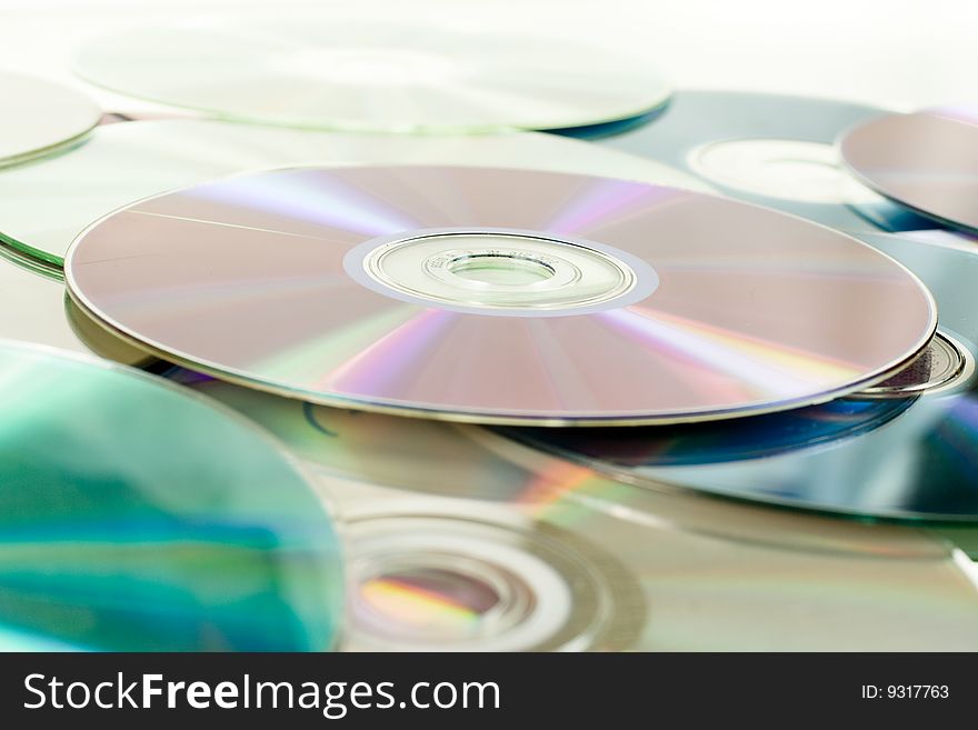 Close up of dvd discs as background, rainbow reflection