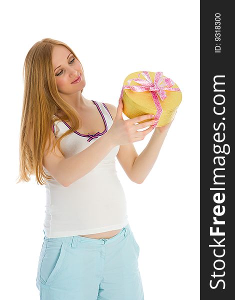 Pregnant caucasian woman holding a gift in his hands. Pregnant caucasian woman holding a gift in his hands