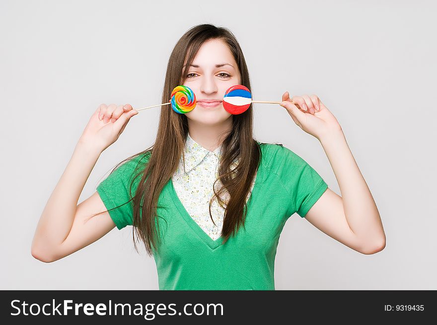Attractive Girl With Lollipops