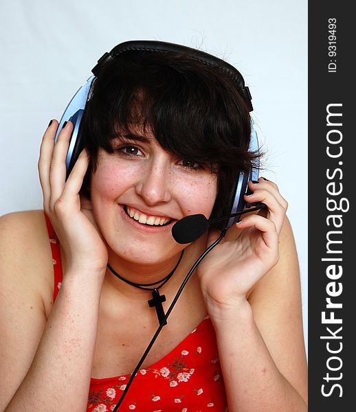 Smiling young DJ girl in red sarafan isolated over white