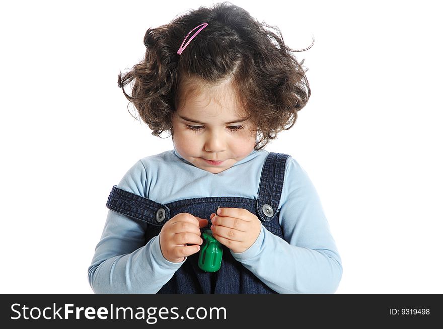 Image of a little girl holding tools isolated on white background