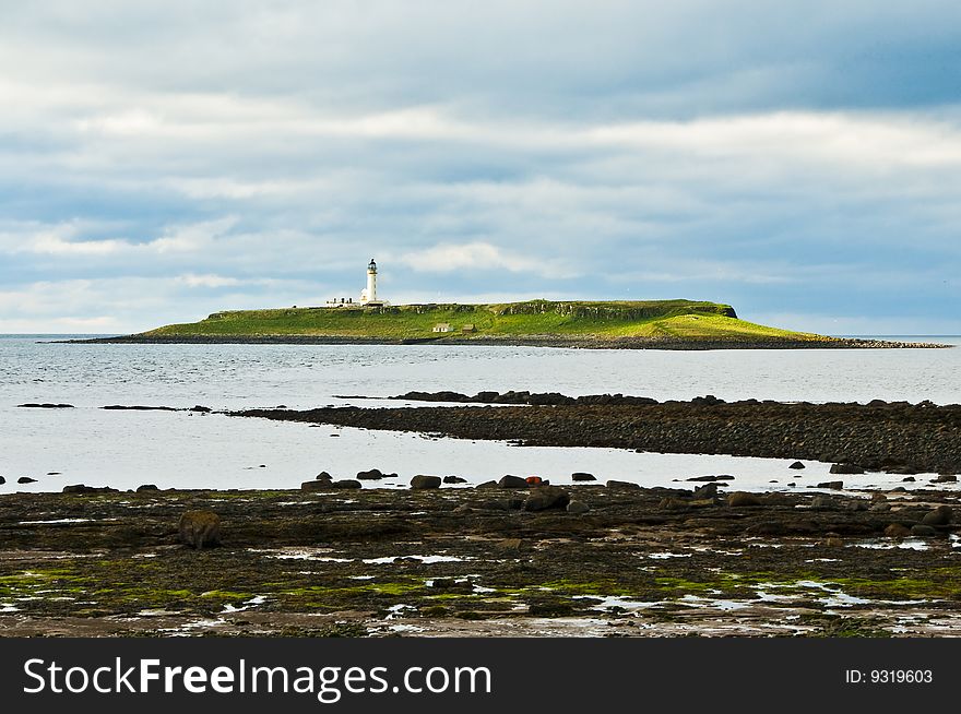 View from Arran of Plada Island with lighthouse. View from Arran of Plada Island with lighthouse