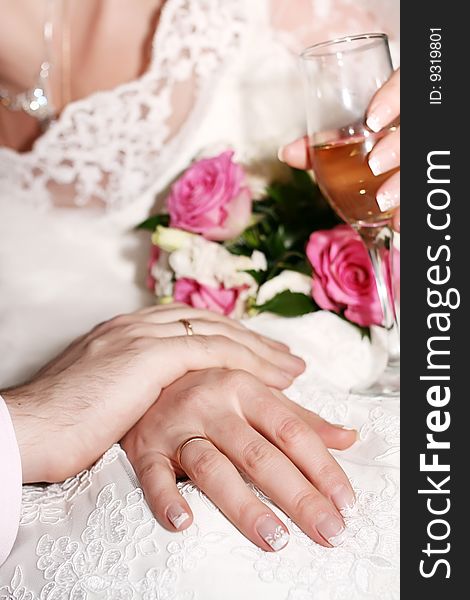 Wedding, hands with rings. A happy newly-married couple.