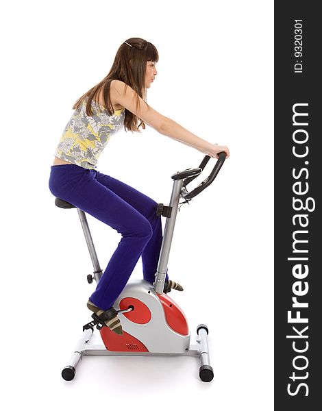 Teenager doing fitness on a stationary bike