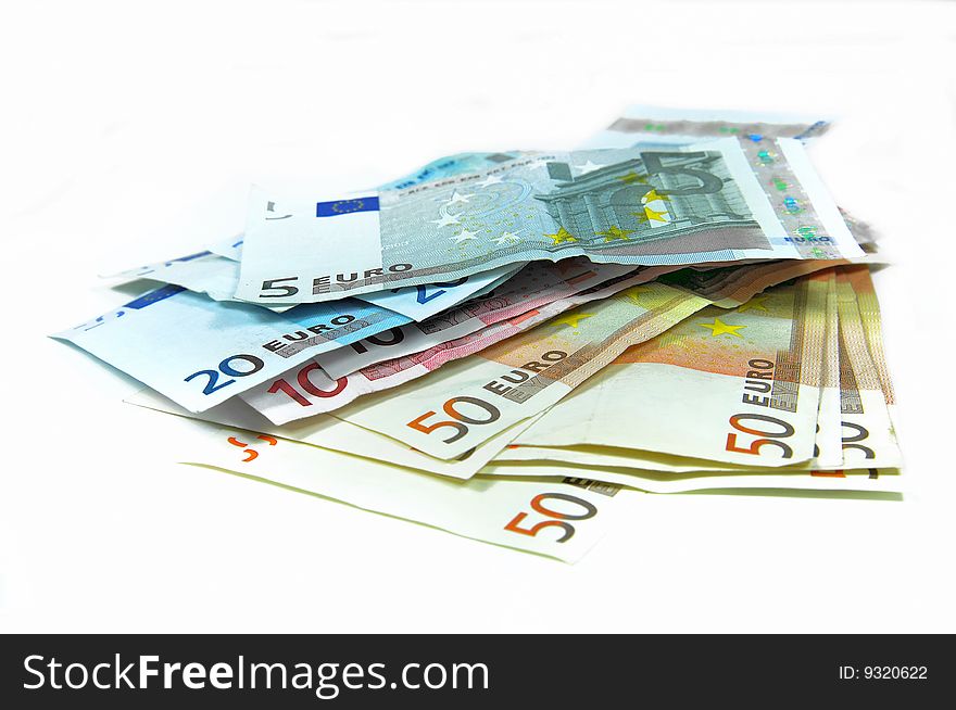 Stack of Euro banknotes isolated on white