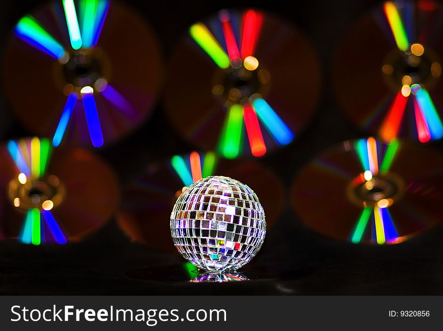 Disco Ball Over Music CDS With Rainbow Reflections