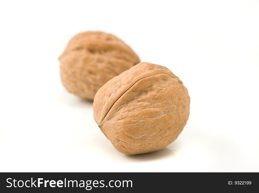 Two Walnuts On White Background