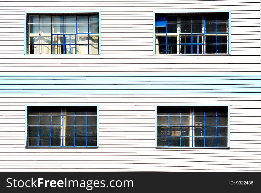 Windows On Blue White Facade