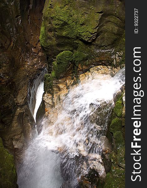 Scroll of a stream between the rocks. Scroll of a stream between the rocks