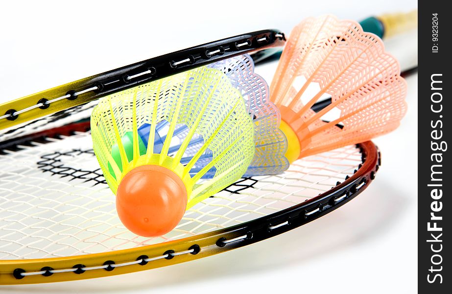 Badminton racquets with shuttlecock on white background. Badminton racquets with shuttlecock on white background
