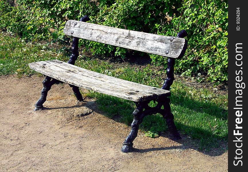 Old bench wooden and  ferrous in park